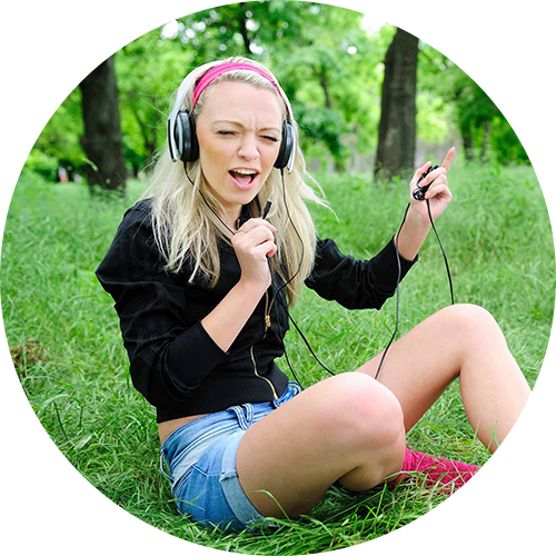 Fun girl singing in the park